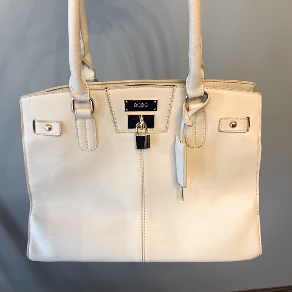 BCBG PARIS cream key lock handbag purse